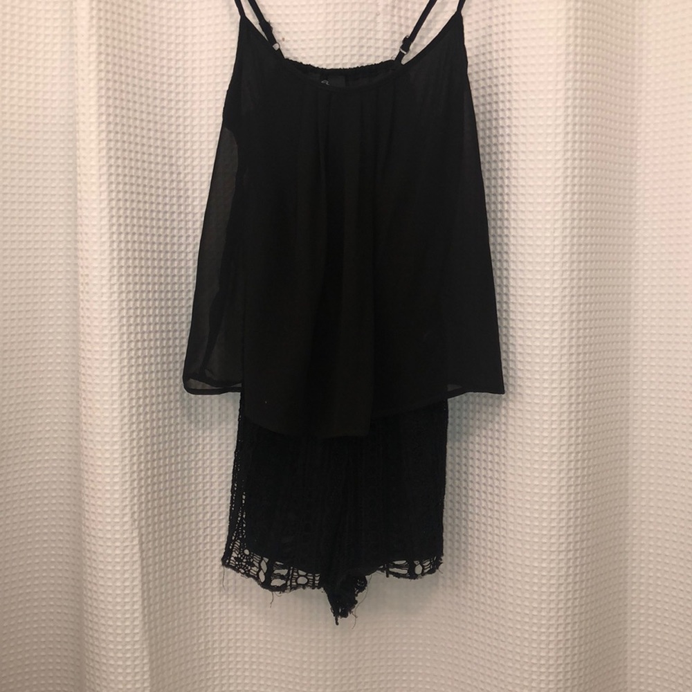 Black flowy romper on top and lace shorts
